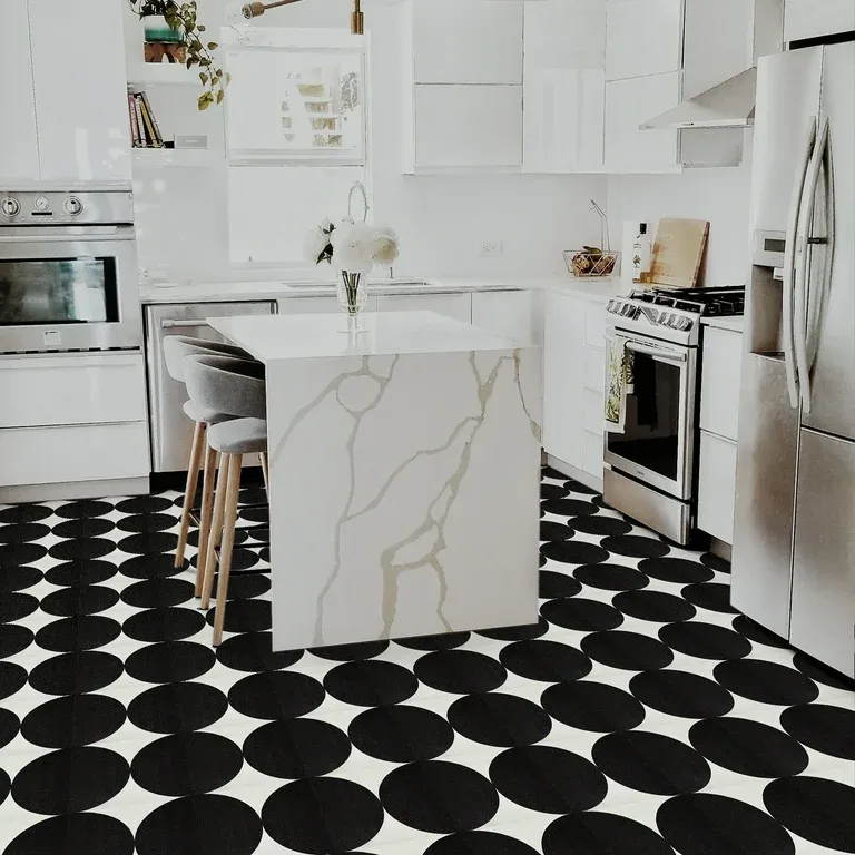 Circular ceramic tiles bring soft, flowing shapes to kitchen floors, perfect for adding charm and visual interest in small or mosaic-style spaces.